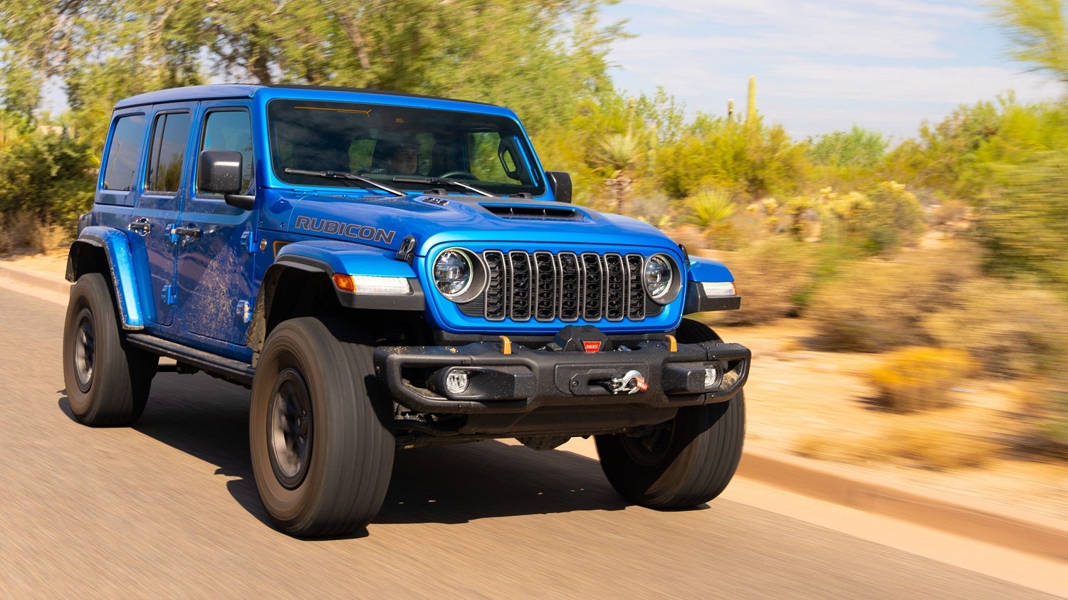 2026 Jeep Wrangler 392 with HEMI V8 hood scoop and 35-inch tires at McCarthy Jeep Ram Chrysler Dodge in Lee's Summit, MO
